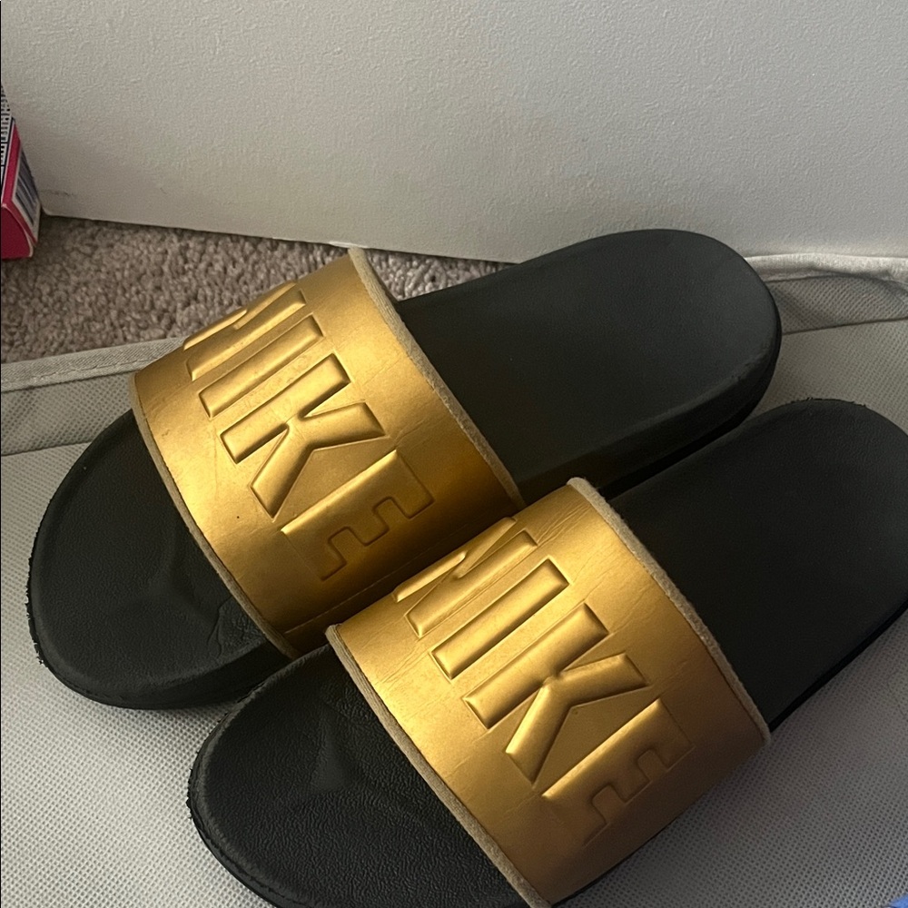Nike Black and Gold Slide Sandals